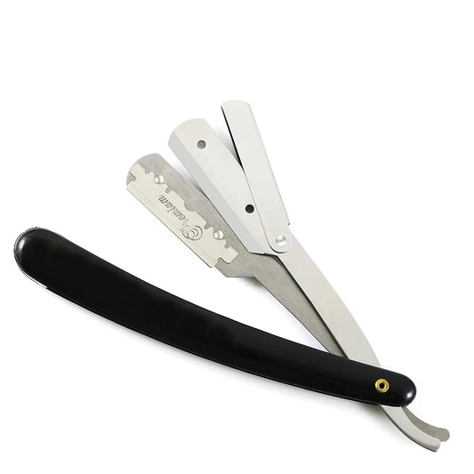 Shaving razor with black handle and silver blade on a white background