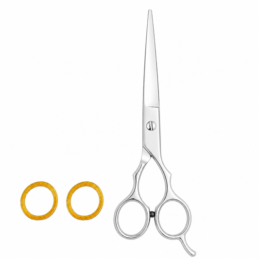 A pair of long silver professional hair shears scissors shown next to two textured gold circular hair tips on a solid white background.